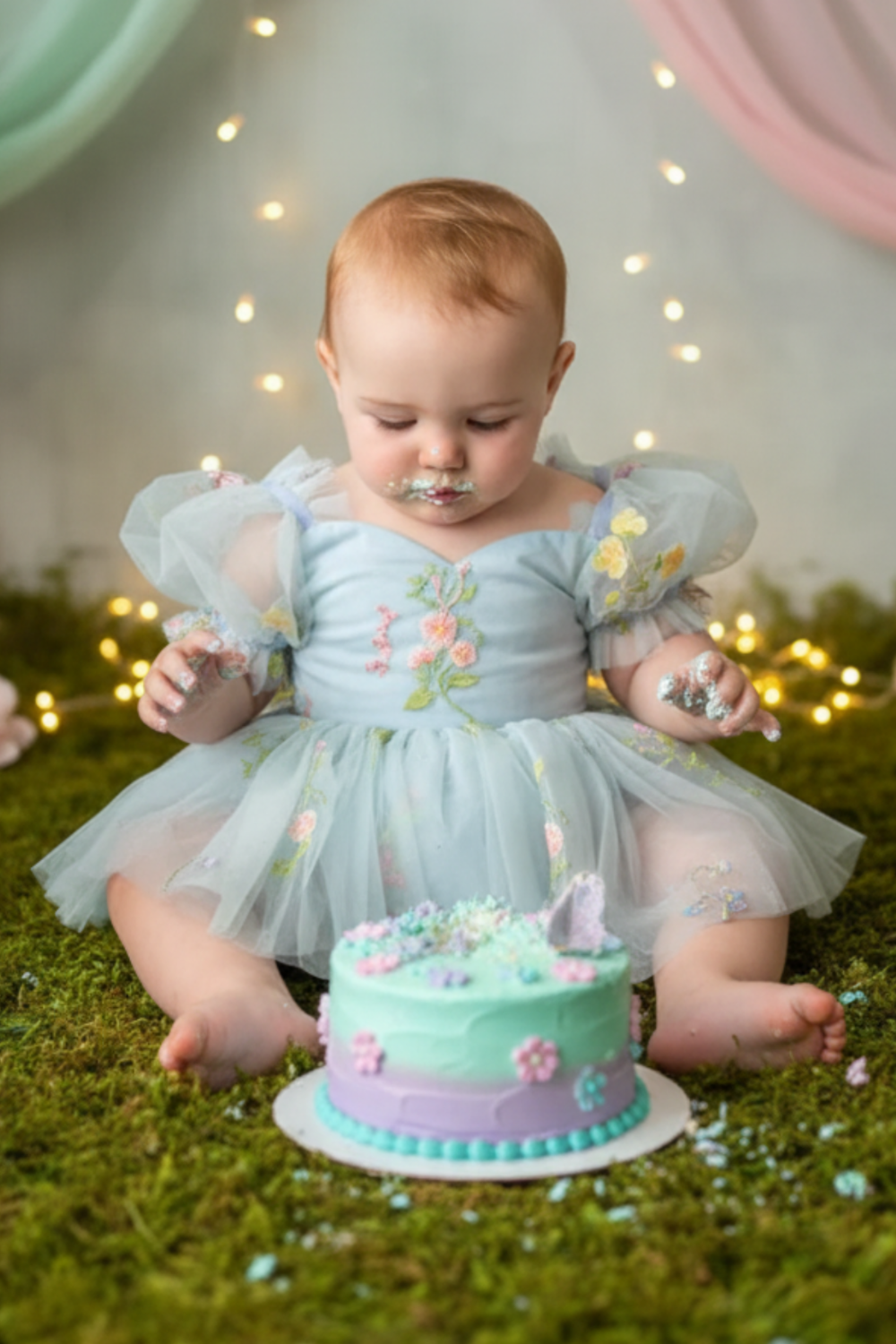 first birthday dress in embroidered floral light blue tulle romper style dress.  