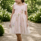 floral flower girl dress in light pink embroidered floral tulle and a knee length style. 