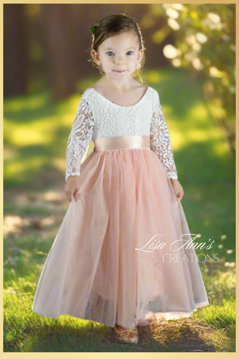 Flower girl dress in a light peach tulle with a long sleeve white lace top. 