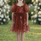 rust flower girl dress in florals. 