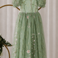 floral  sage flower girl dress in full length with puffy sleeves and in bow in back. 