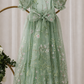 sage floral flower girl dress showing back of dress with big bow. 