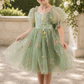 wildflower flower girl dress in sage green embroidered florals knee length dress with big puffy sleeves. 