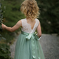 Sage green flower girl dress in tulle with sleeveless white lace. 