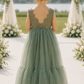 flower girl dress in sage green tulle and lace with a full mermaid style skirt. 