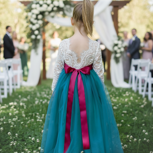Flower girl dress in teal tulle with long lace white bodice. 