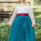 Tulle flower girl dress in teal with white lace bodice and full length skirt
