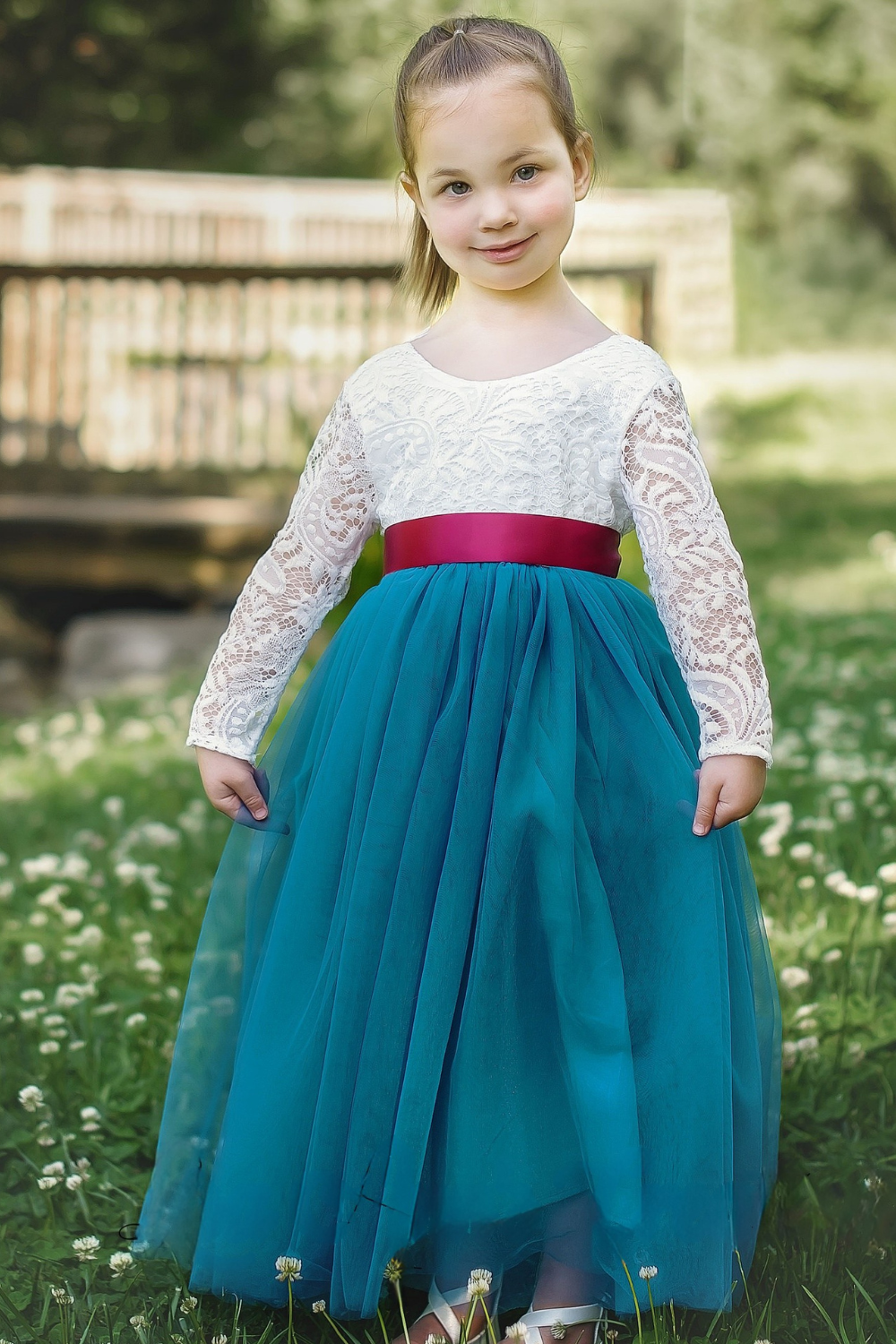 Tulle flower girl dress in teal with white lace bodice and full length skirt