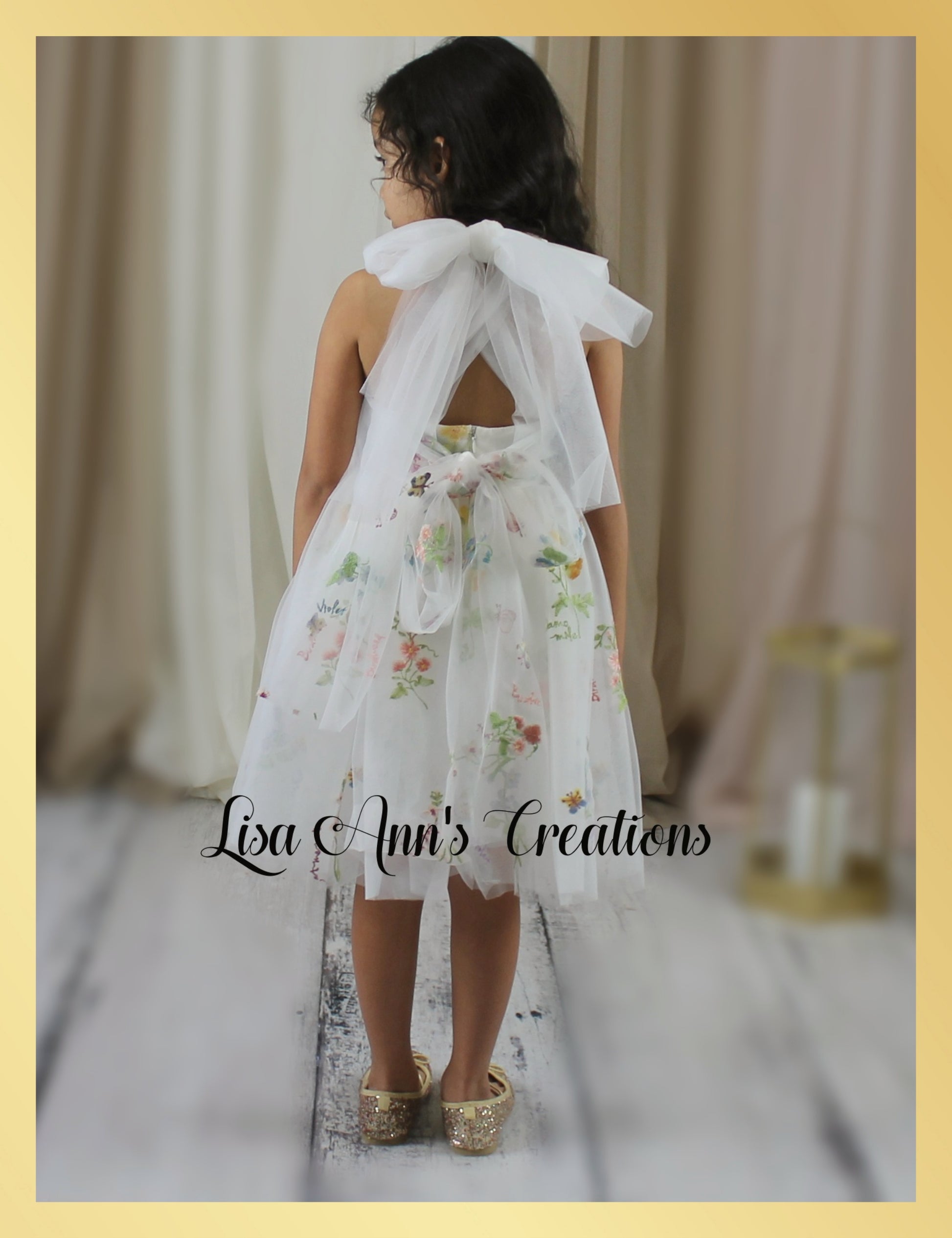 Flower girl dress with floral embroidery in white tulle