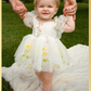 white flower girl dress with embroidered flowers