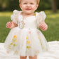 Wildflower first birthday baby girl dress in embroidered flowers. 