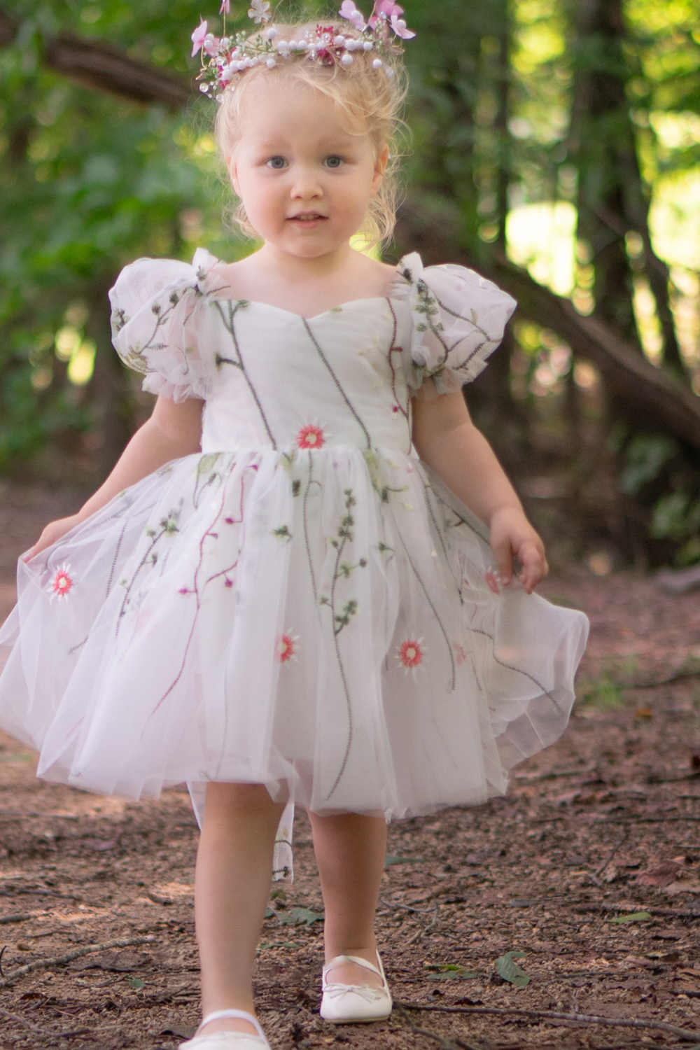 White floral girls and baby dress for flower girls, first birthdays and special occasions.  Sweetheart neckline, puffy sleeves, and knee length style in a fall floral tulle dress.