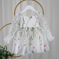 white floral flower girl dress for baby's, toddlers and little girls. made with long sheer sleeves a sweat heart neckline and knee length style for all your special occasions.