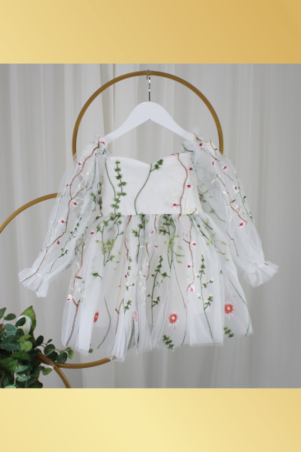 white floral flower girl dress for baby's, toddlers and little girls. made with long sheer sleeves a sweat heart neckline and knee length style for all your special occasions.