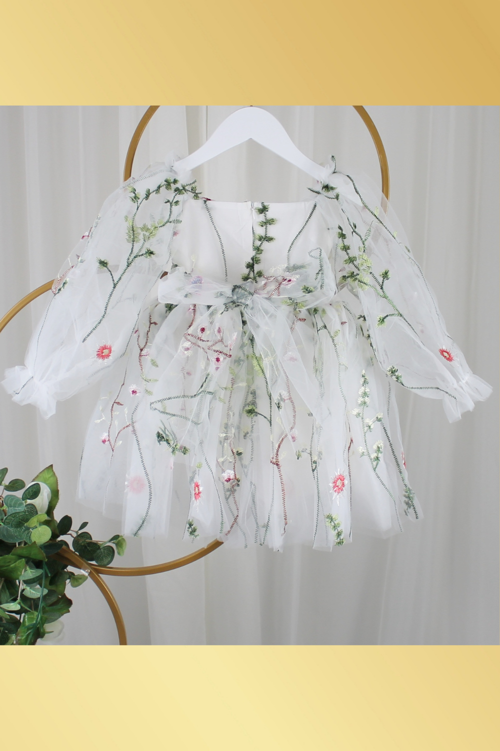 white floral flower girl dress for baby's, toddlers and little girls. made with long sheer sleeves a sweat heart neckline and knee length style for all your special occasions.