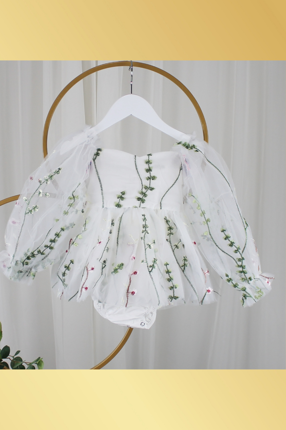 white floral flower girl dress for baby's, toddlers and little girls. made with long sheer sleeves a sweat heart neckline and knee length style for all your special occasions.