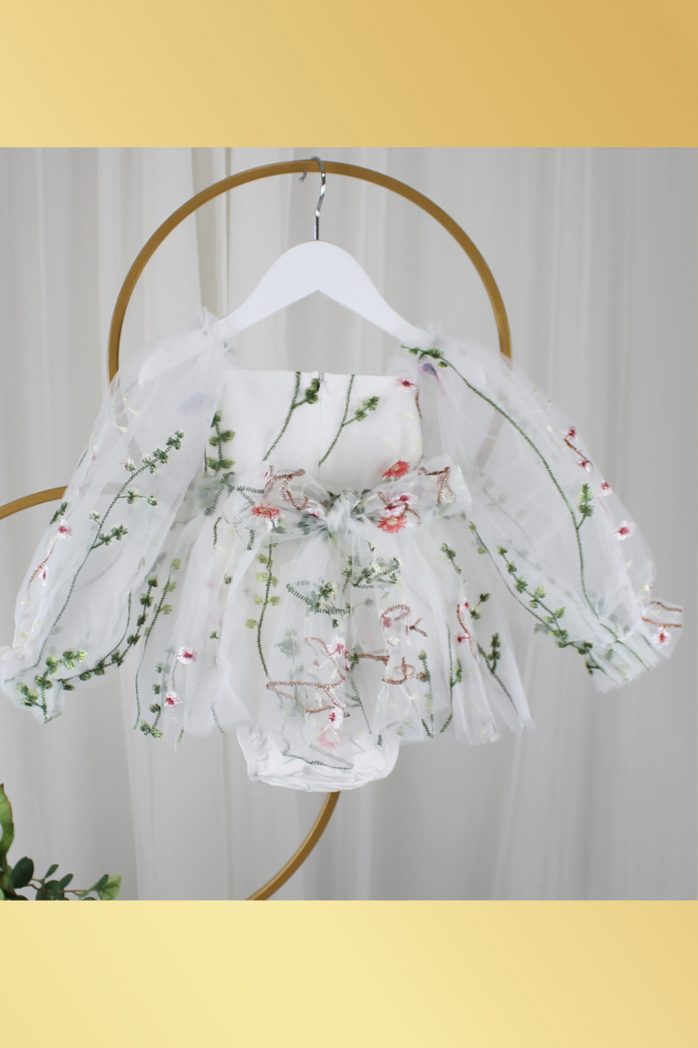 white floral flower girl dress for baby's, toddlers and little girls. made with long sheer sleeves a sweat heart neckline and knee length style for all your special occasions.