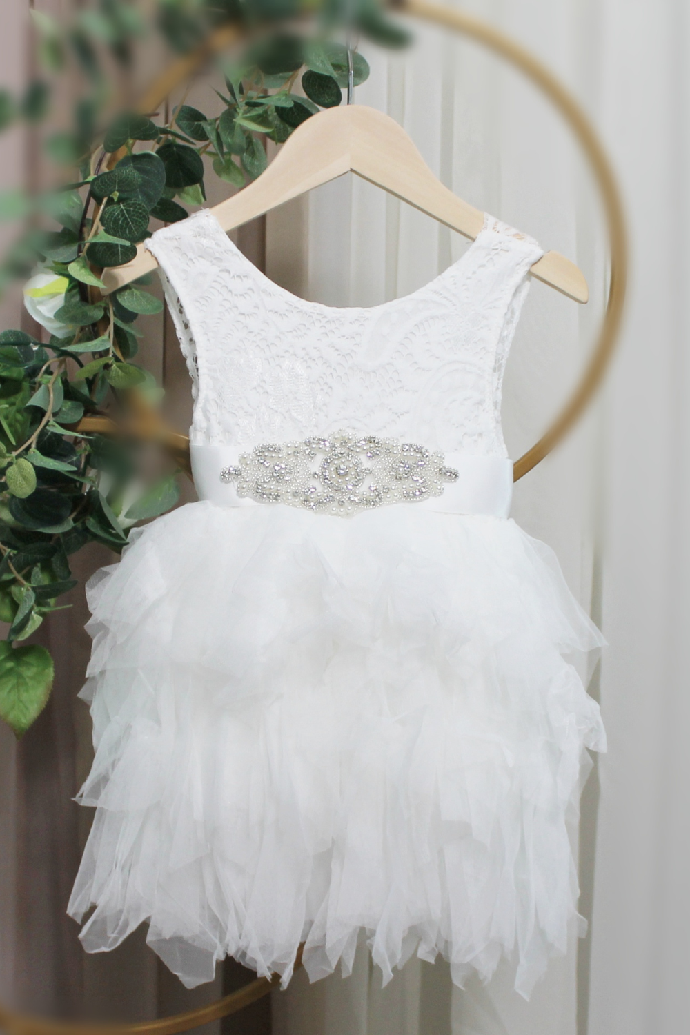 White Flower Girl Dress in white lace sleeveless top and white tiered tutu style knee length style. 