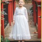 All white flower girl dress in long sleeve lace and tulle