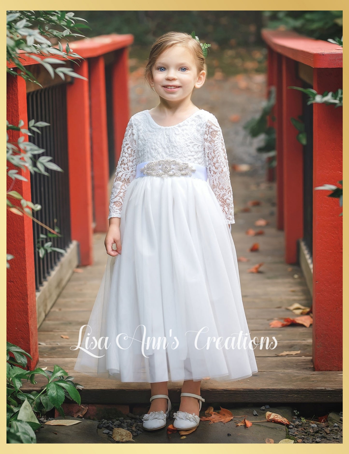 All white flower girl dress in long sleeve lace and tulle