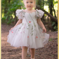 White floral girls and baby dress for flower girls, first birthdays and special occasions.  Sweetheart neckline, puffy sleeves, and knee length style in a fall floral tulle dress.