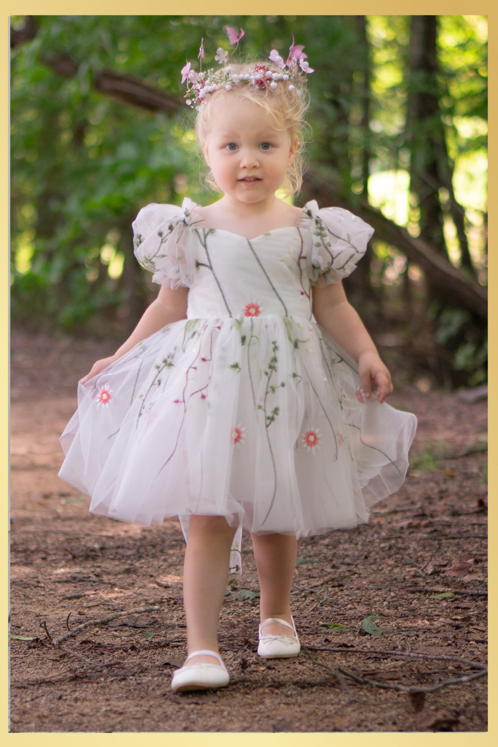 White floral girls and baby dress for flower girls, first birthdays and special occasions.  Sweetheart neckline, puffy sleeves, and knee length style in a fall floral tulle dress.