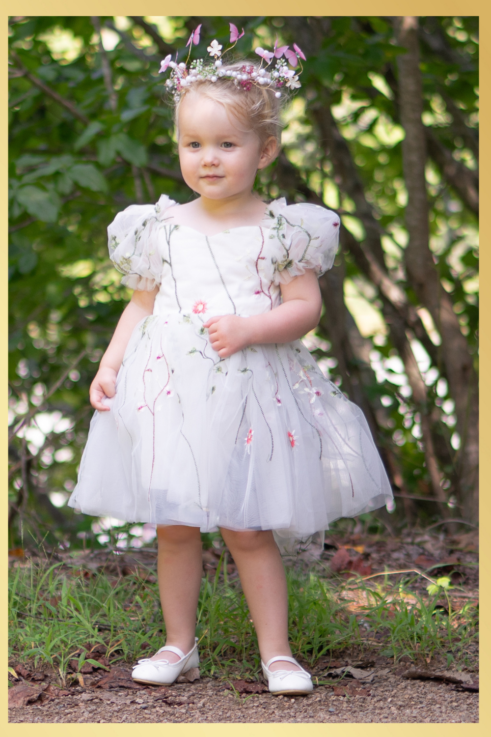 White floral girls and baby dress for flower girls, first birthdays and special occasions.  Sweetheart neckline, puffy sleeves, and knee length style in a fall floral tulle dress.