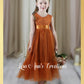 Sleeveless flower girl dress in burnt orange tulle 