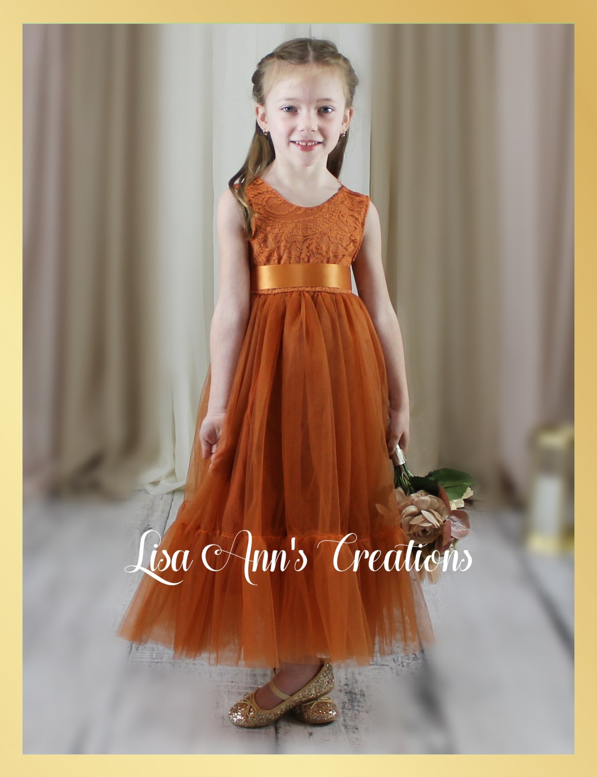 Sleeveless flower girl dress in burnt orange tulle 