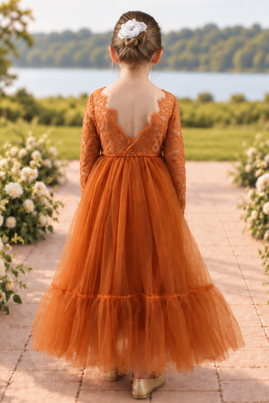 burnt orange flower girl dress in a mermaid style with long lace sleeves