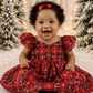 baby girl Christmas dress in red and green plaid in a romper style. 