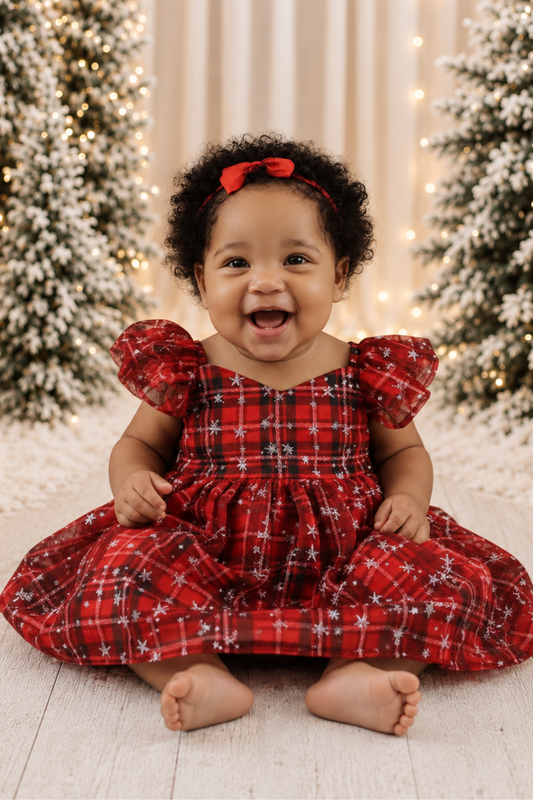 baby girl Christmas dress in red and green plaid in a romper style. 
