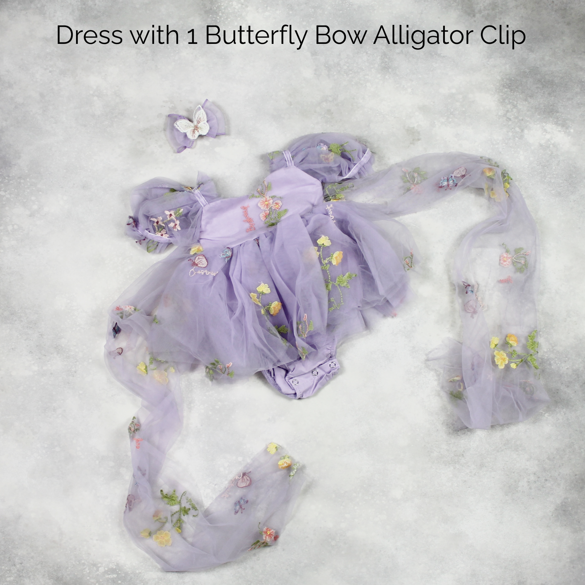 First birthday baby girl dress in lavender floral tulle with built in romper/bodysuit and puffy  short sleeves.