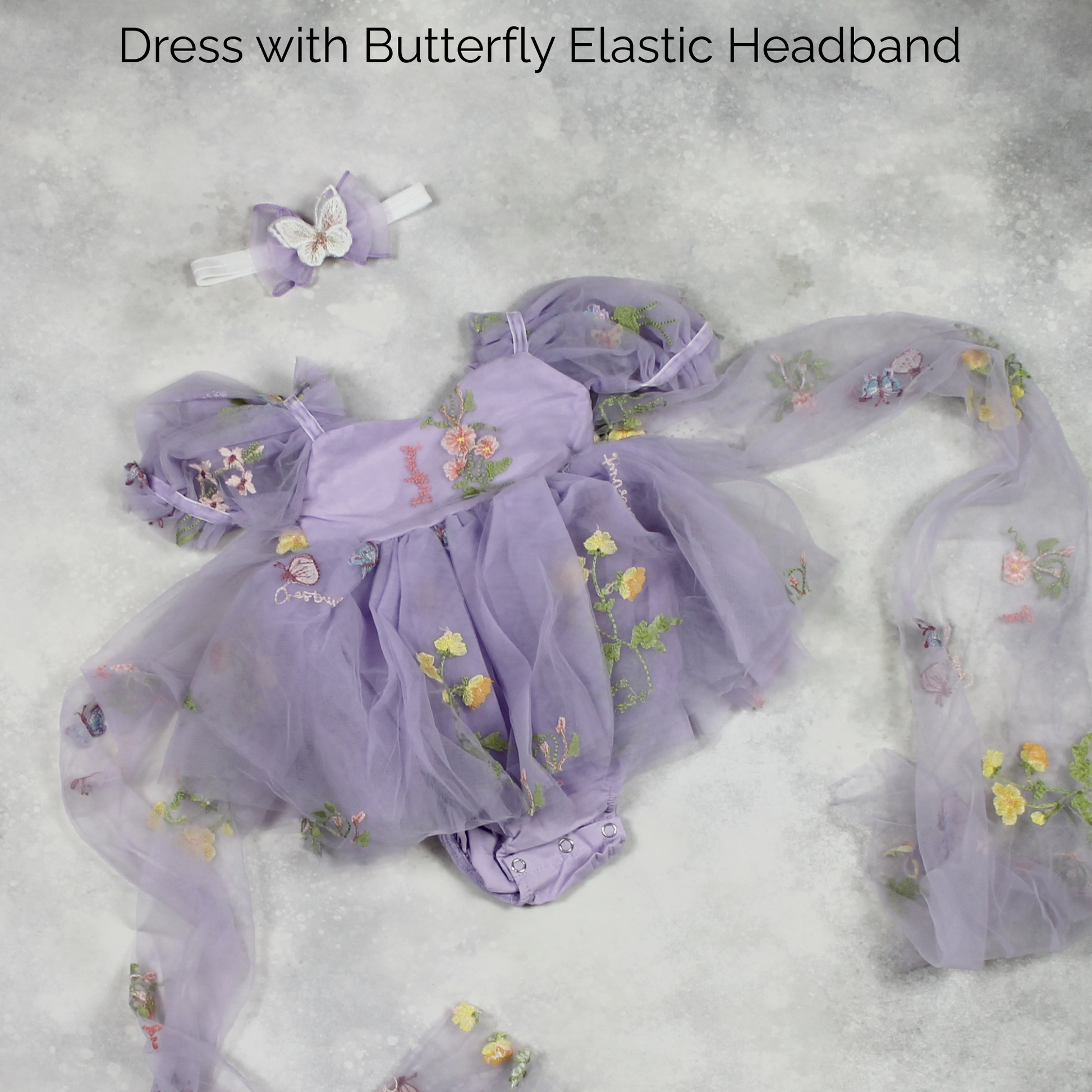 First birthday baby girl dress in lavender floral tulle with built in romper/bodysuit and puffy  short sleeves.