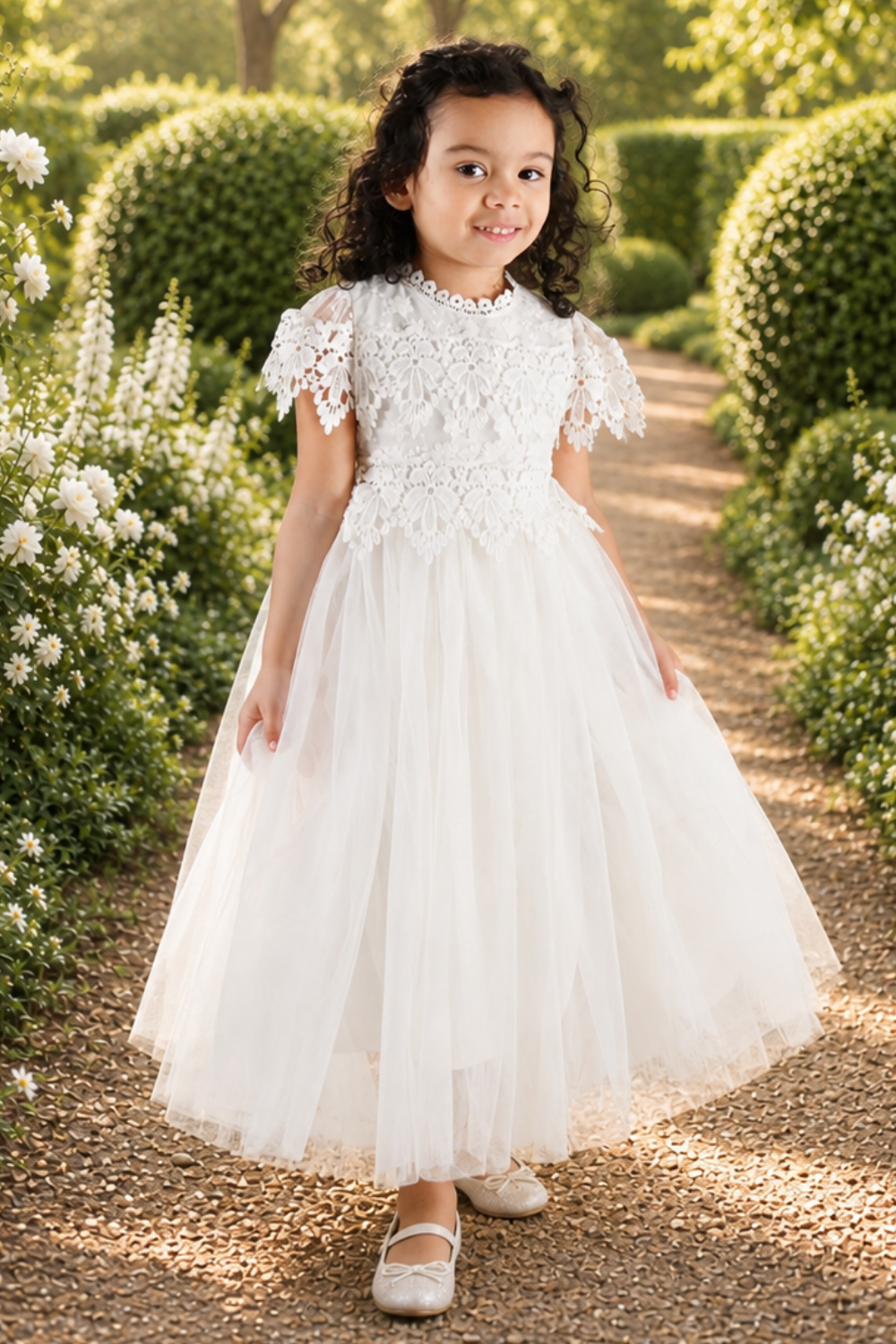 white flower girl dress with crochet flower pattern. great for a 1st communion dress. 
