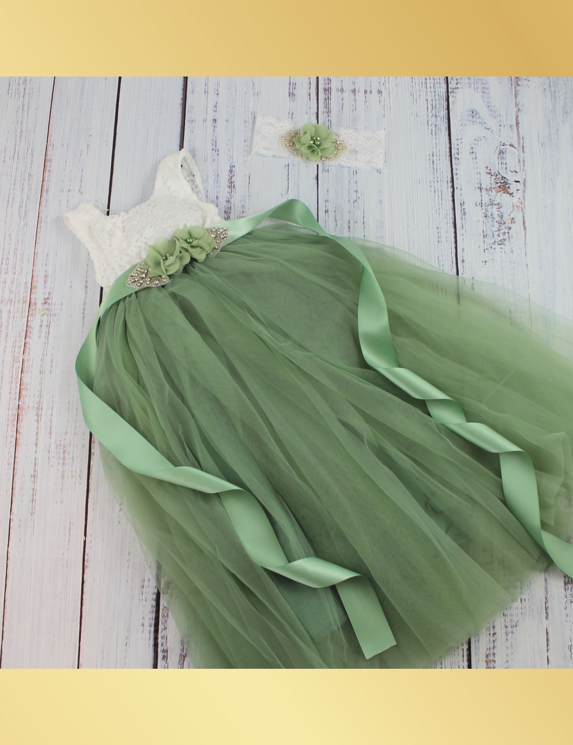 Full length flower girl dress in sage green with white sleeveless lace